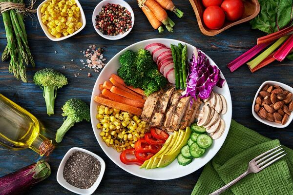 Colorful balanced meal with vegetables and grains on a table